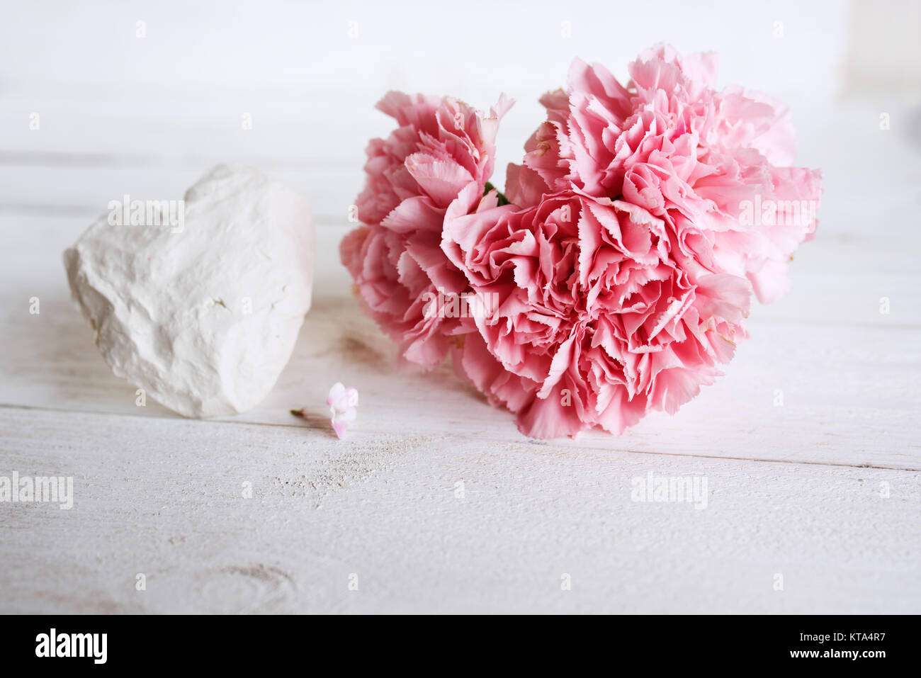 Decoration with two hearts on a white wooden table in vintage style for ...