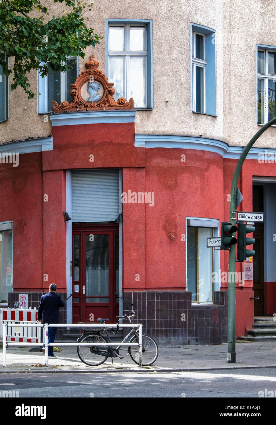 Berlin Schöneberg, Bülowstraße. Old apartment building with decorative sculptural detail above the entrance. Crest over door Stock Photo