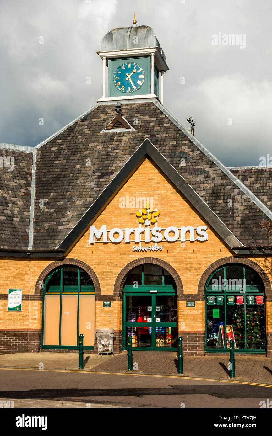 Entrance To A Modern Morrisons Supermarket Bathed In Warm Sunlight 