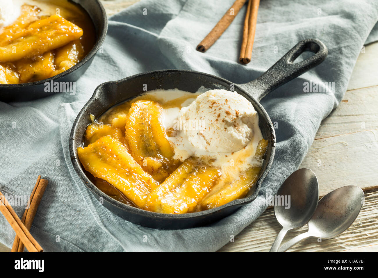 Homemade Sauteed Bananas Foster with Cinnamon and Ice Cream Stock Photo