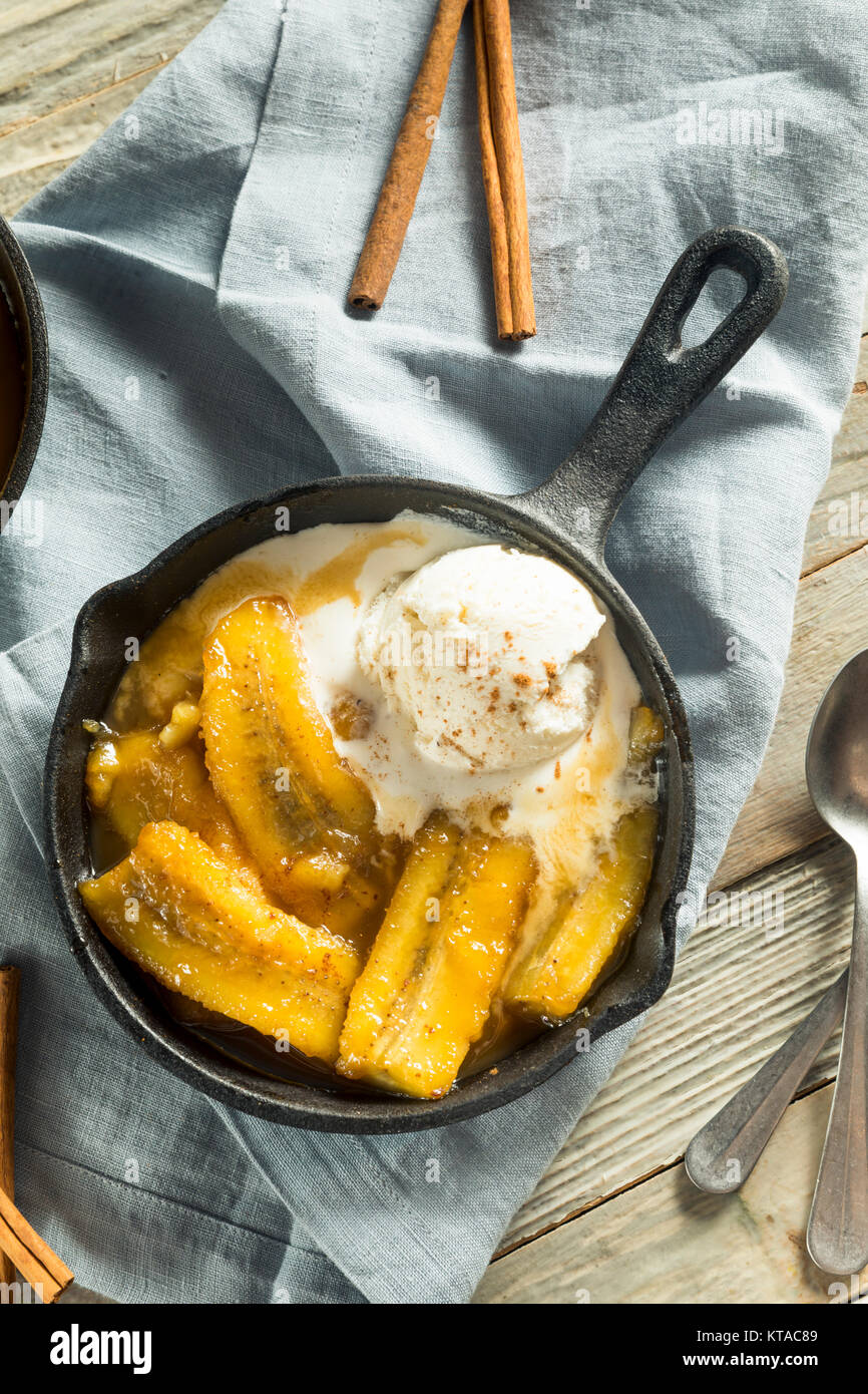 Homemade Sauteed Bananas Foster with Cinnamon and Ice Cream Stock Photo