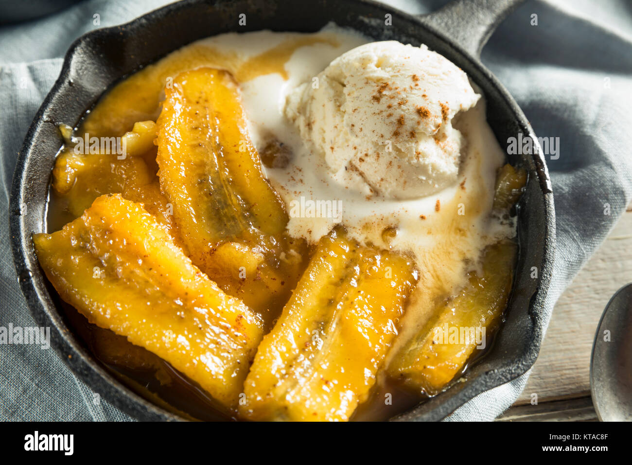 Homemade Sauteed Bananas Foster with Cinnamon and Ice Cream Stock Photo