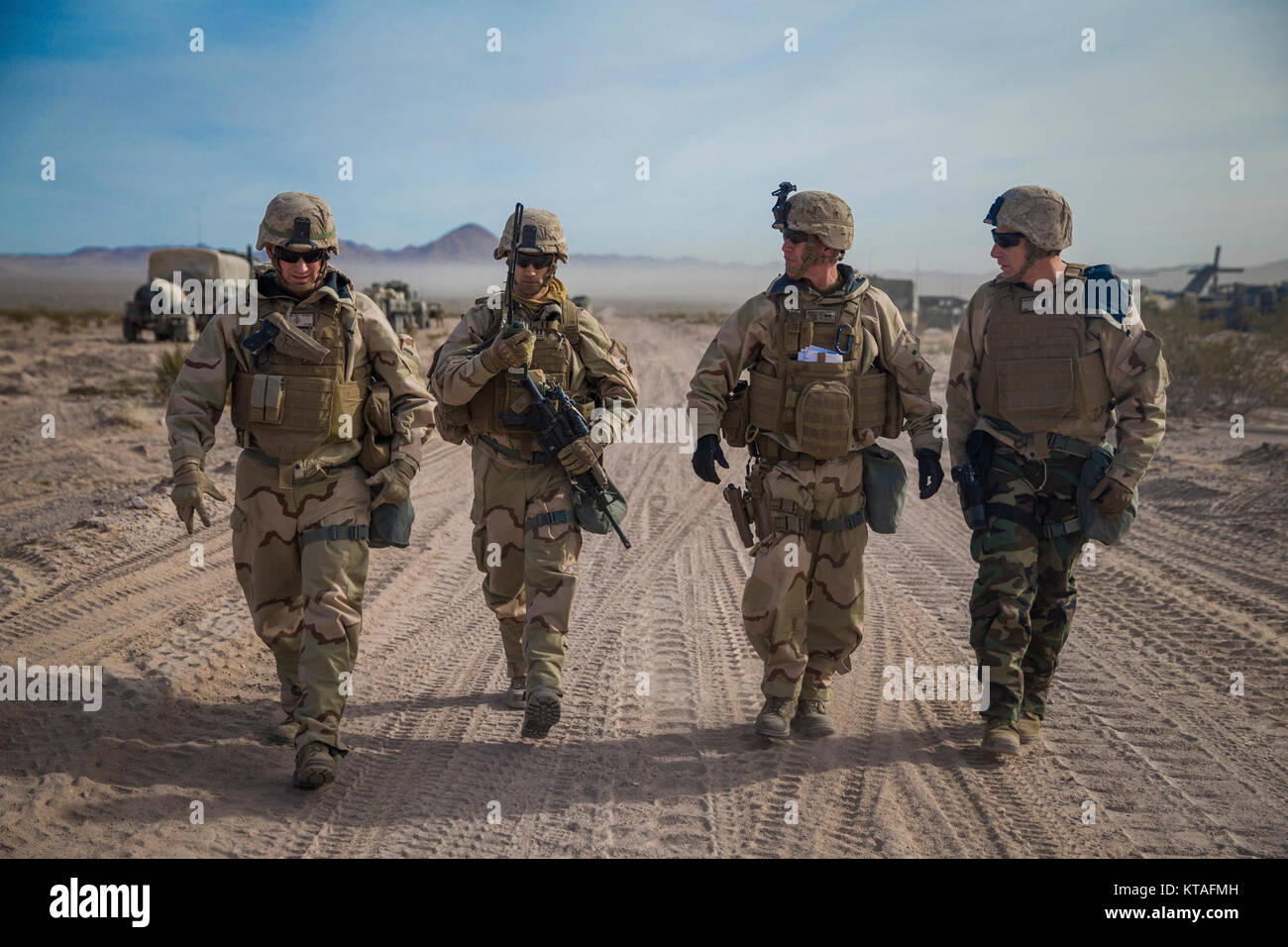 U.S. Marine Corps Maj. Gen. Eric M. Smith, center right, the commanding general for 1st Marine Division, walks alongside his staff during a battle field circulation (BFC) at Marine Corps Air Ground Combat Center, Twentynine Palms, Calif., Dec. 10, 2017. Smith's BFC consisted of visiting various units participating in exercise Steel Knight 2018. (U.S. Marines Corps Stock Photo
