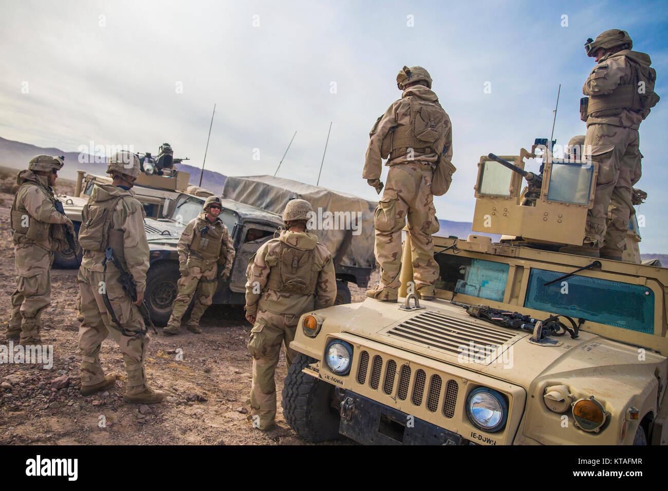 U.S. Marine Corps Sgt. Maj. William T. Sowers, center left, the Sgt. Maj. of 1st Marine Division, talks with Marines with TOW Platoon, 1st Tank Battalion, during a battle field circulation at Marine Corps Air Ground Combat Center, Twentynine Palms, Calif., Dec. 10, 2017. Foster accompanied U.S. Marine Corps Maj. Gen. Eric M. Smith, the commanding general for 1st Marine Division, as he visited various units participating in exercise Steel Knight 2018. (U.S. Marines Corps Stock Photo