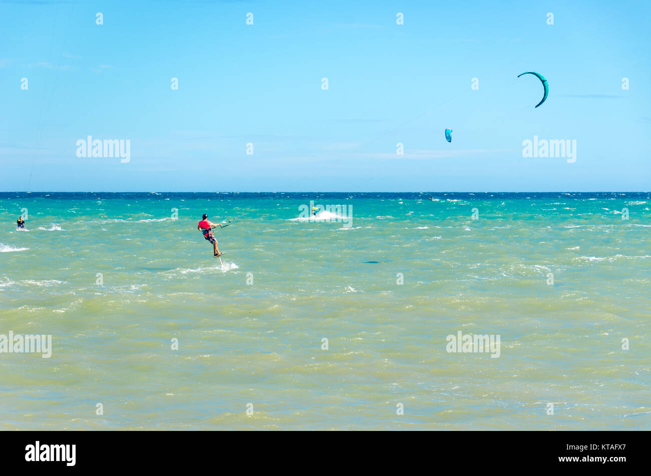 Cumbuco, Brazil, jul 9, 2017: Beach in Cumbuco at the Ceara state with multiple kite surfing sport people Stock Photo
