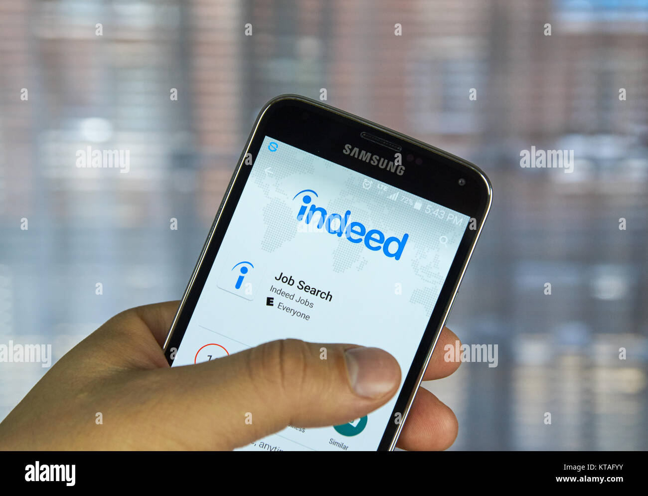 Close-up smartphone screen "trade job search apps"