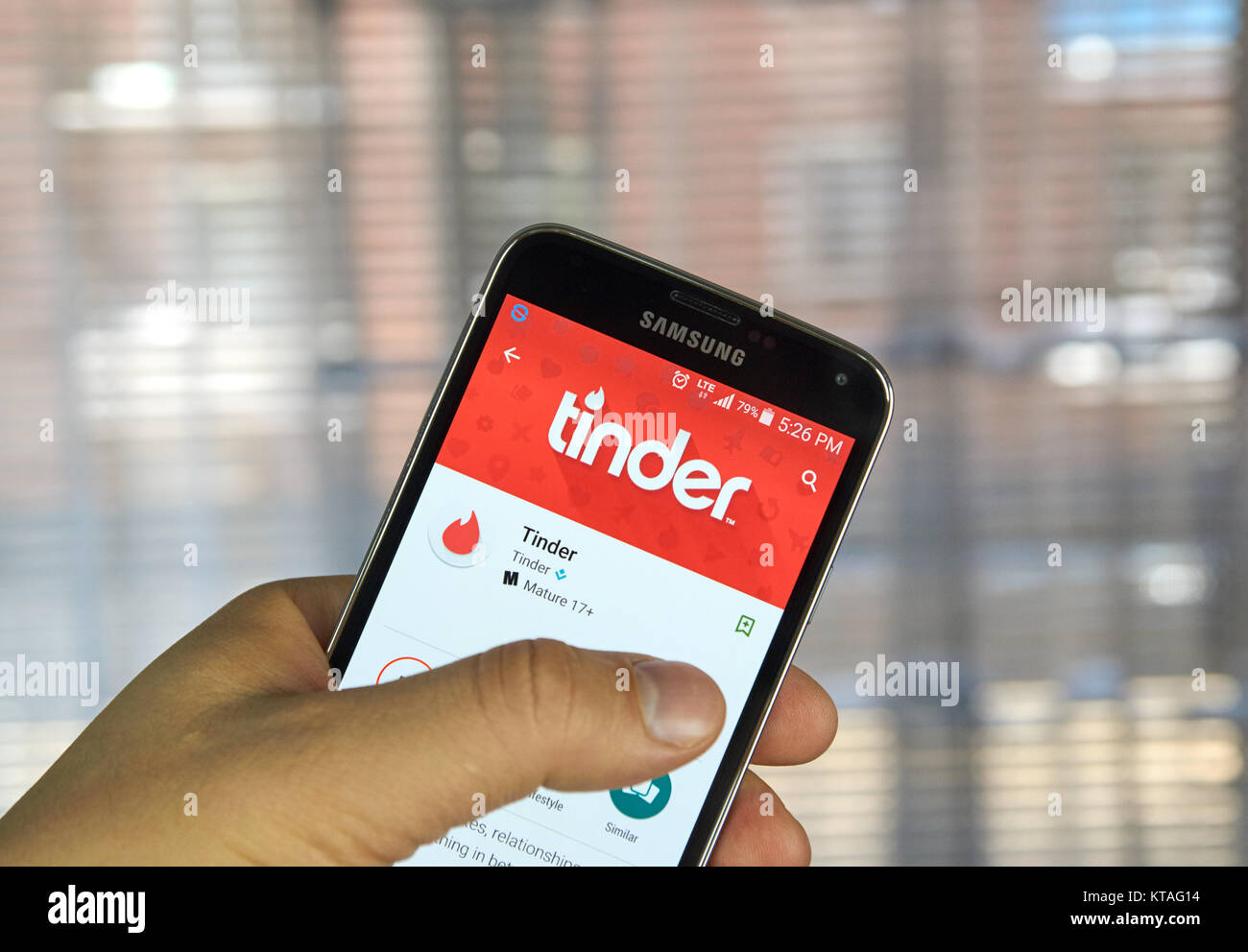 MONTREAL, CANADA - APRIL 5, 2016 : Tinder application on Android phone. Tinder is a location-based dating and social discovery service application Stock Photo