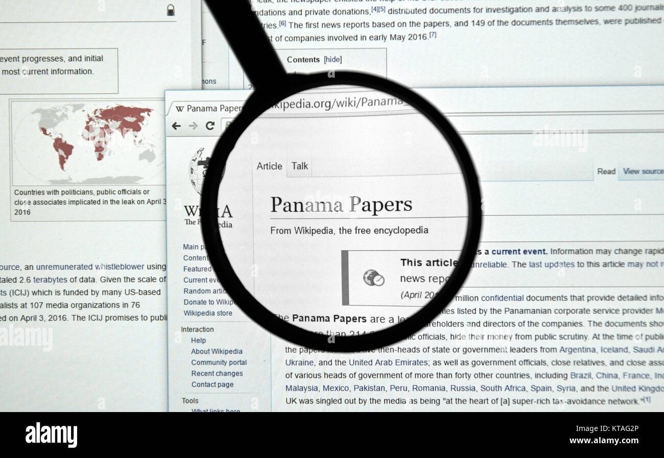 MONTREAL, CANADA - APRIL 7, 2016 : The Panama Papers article on Wikipedia under magnifying glass. The Panama Papers is set of 11.5 million leaked conf Stock Photo