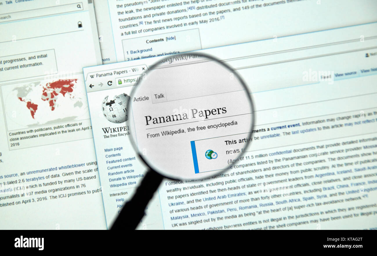MONTREAL, CANADA - APRIL 7, 2016 : The Panama Papers article on Wikipedia under magnifying glass. The Panama Papers is set of 11.5 million leaked conf Stock Photo