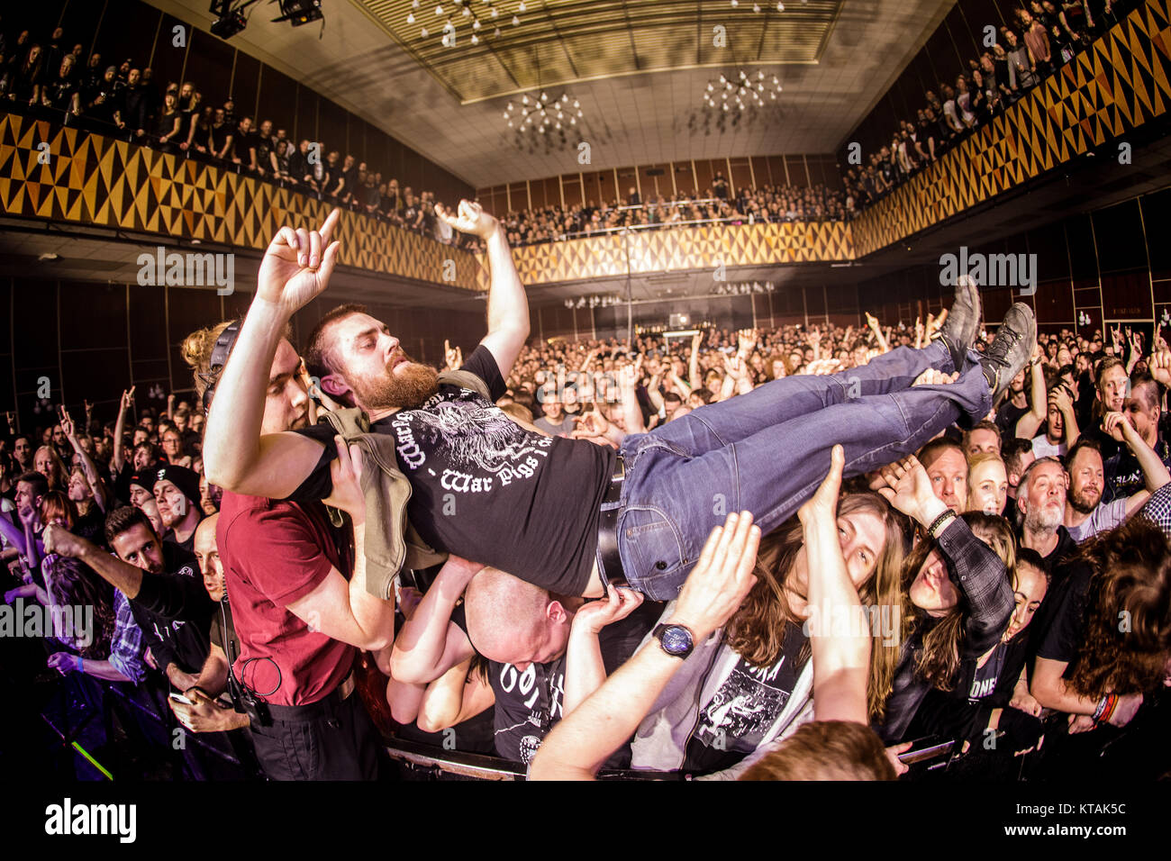 Heavy metal fans attend a concert with the French death metal band Gojira performs at VEGA in Copenhagen. Here guitarist and vocalist Here a concert goer is crowd surfing. Denmark, 09/03 2017. Stock Photo