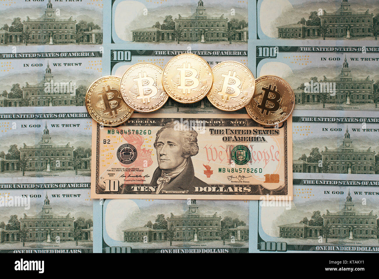 bitcoin symbol on ten dollars background. cryptocurrency technologies  concept. virtual money with real life Stock Photo - Alamy