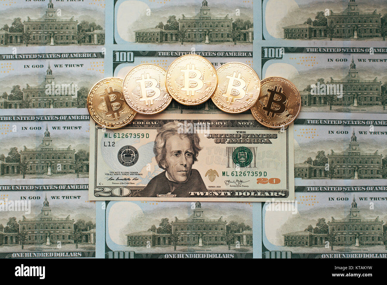 Coins bitcoin, the money lies, on the bill table of 20 dollars. The  banknotes are spread on the table in a free order of 20 dollars. Gold coins  are cr Stock Photo - Alamy
