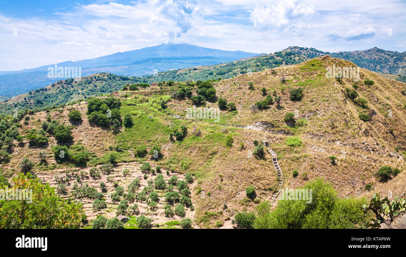 panorama with green mountain slope and Etna mount Stock Photo