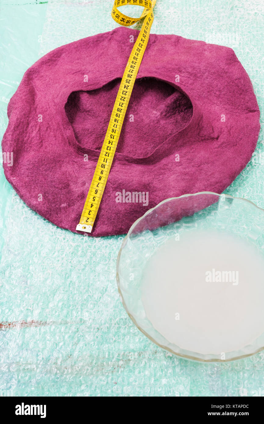 wet felt beret is forming on table 