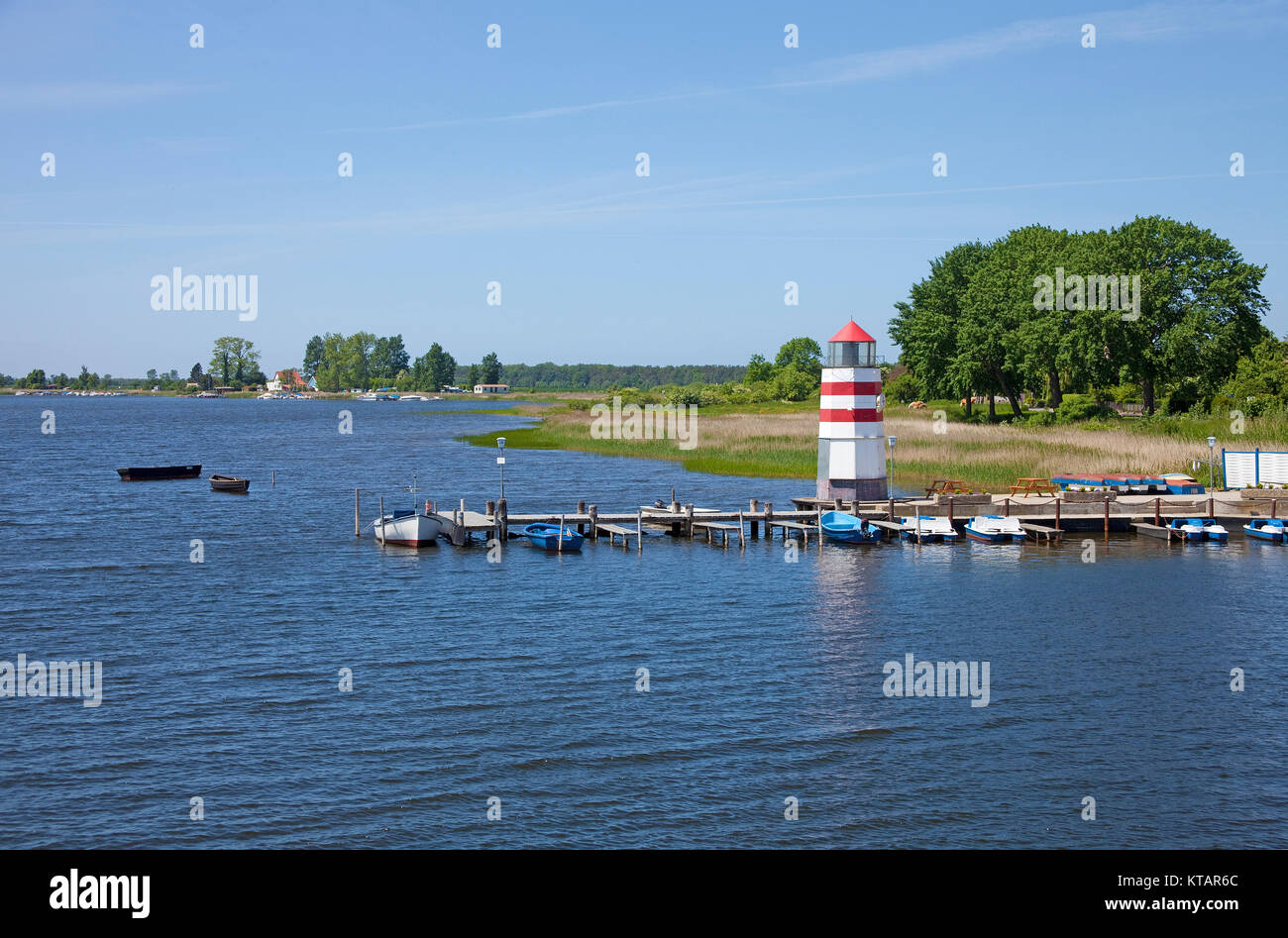 Small lighthouse at the pier, fishing village Waase, Ummanz island, National park Vorpommersche Boddenlandschaft, Ruegen island, Baltic Sea, Germany Stock Photo