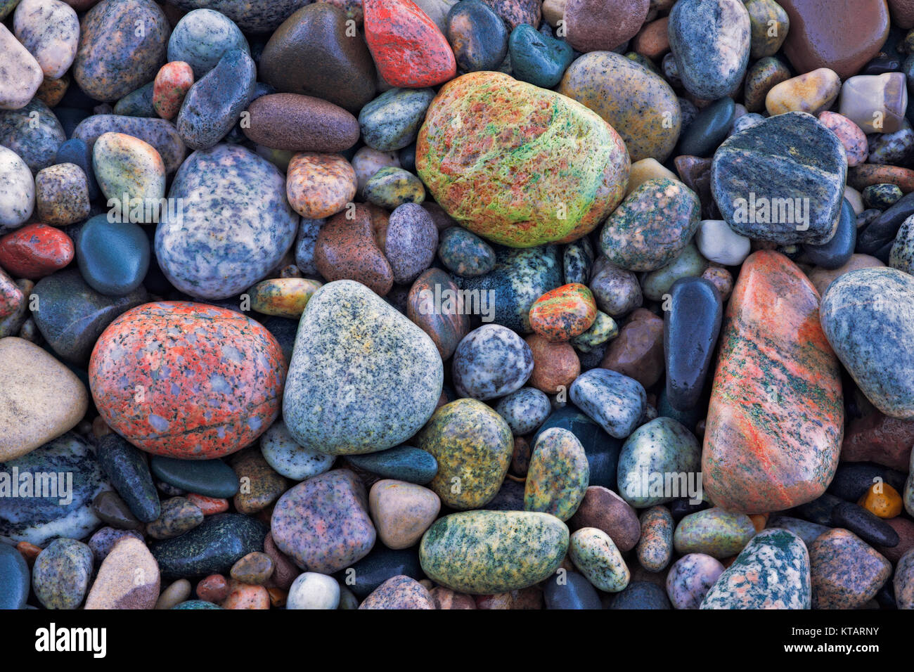 Colorful rocks found along the shoreline of Lake Superior at Au Sable Point in Pictured Rocks National Lakeshore and Michigan’s Upper Peninsula. Stock Photo