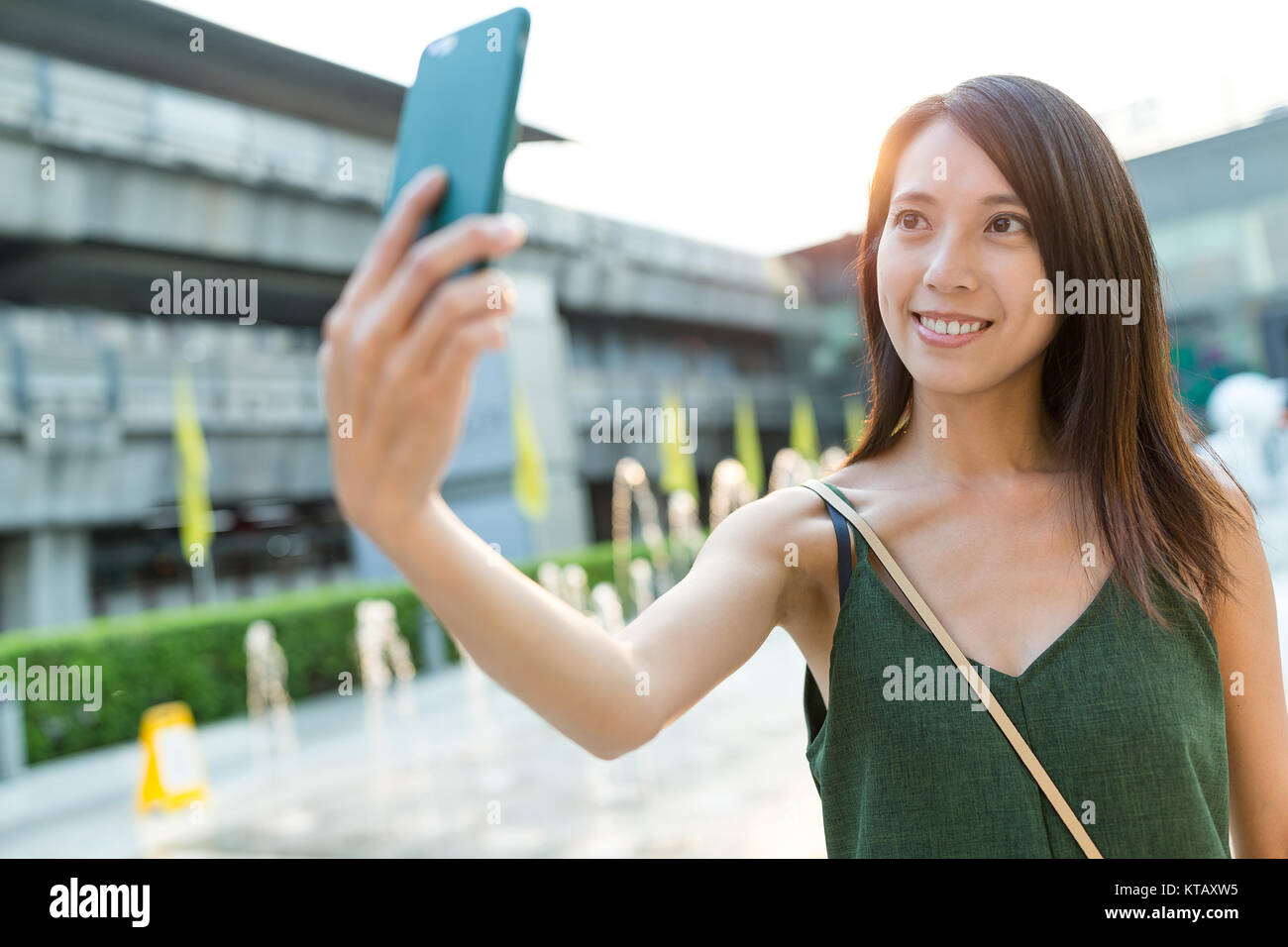 Woman taking selfie by mobile phone Stock Photo - Alamy