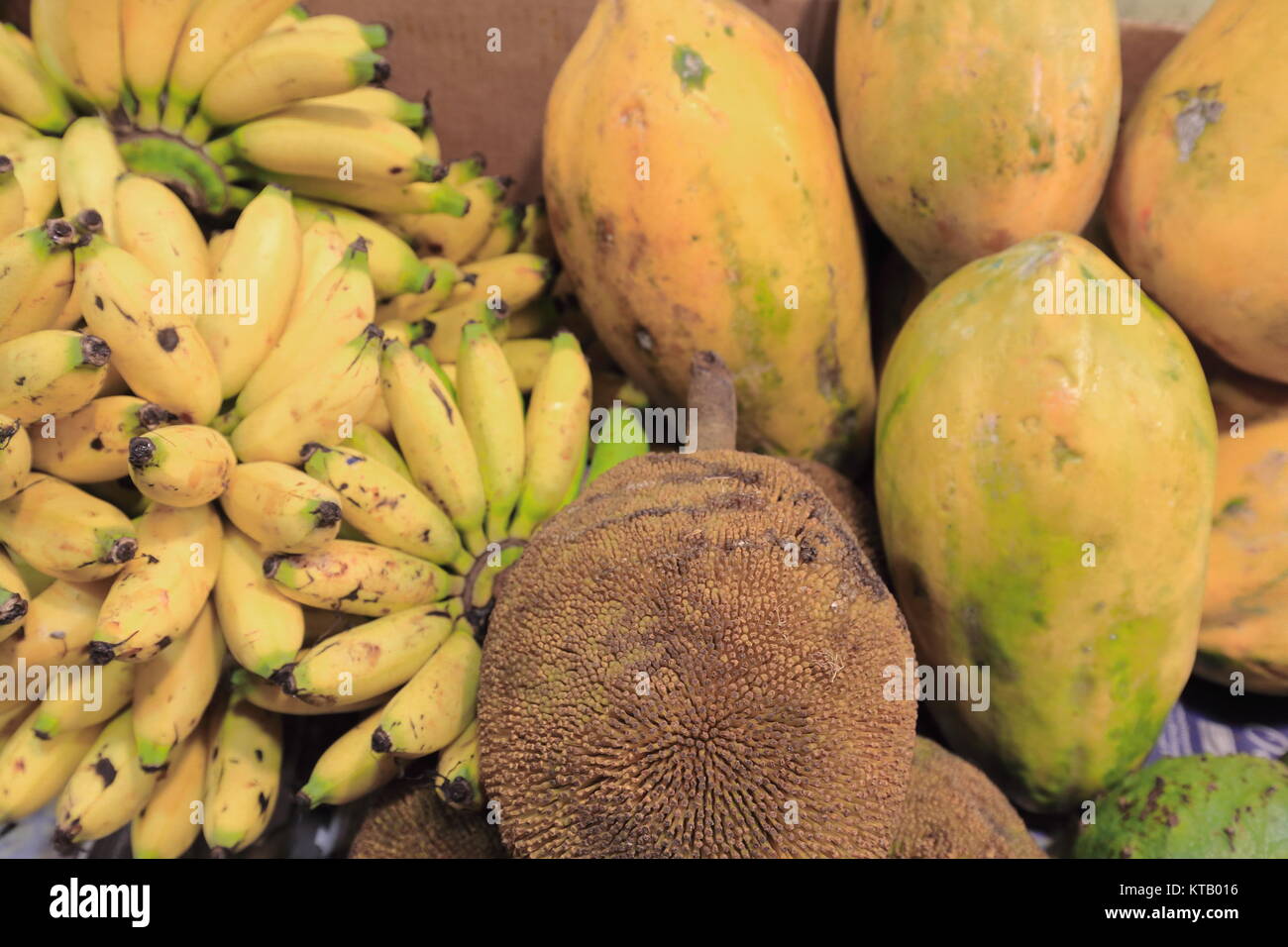 Bunch of bananayellow mangodurian fruits piled togetherstall on the