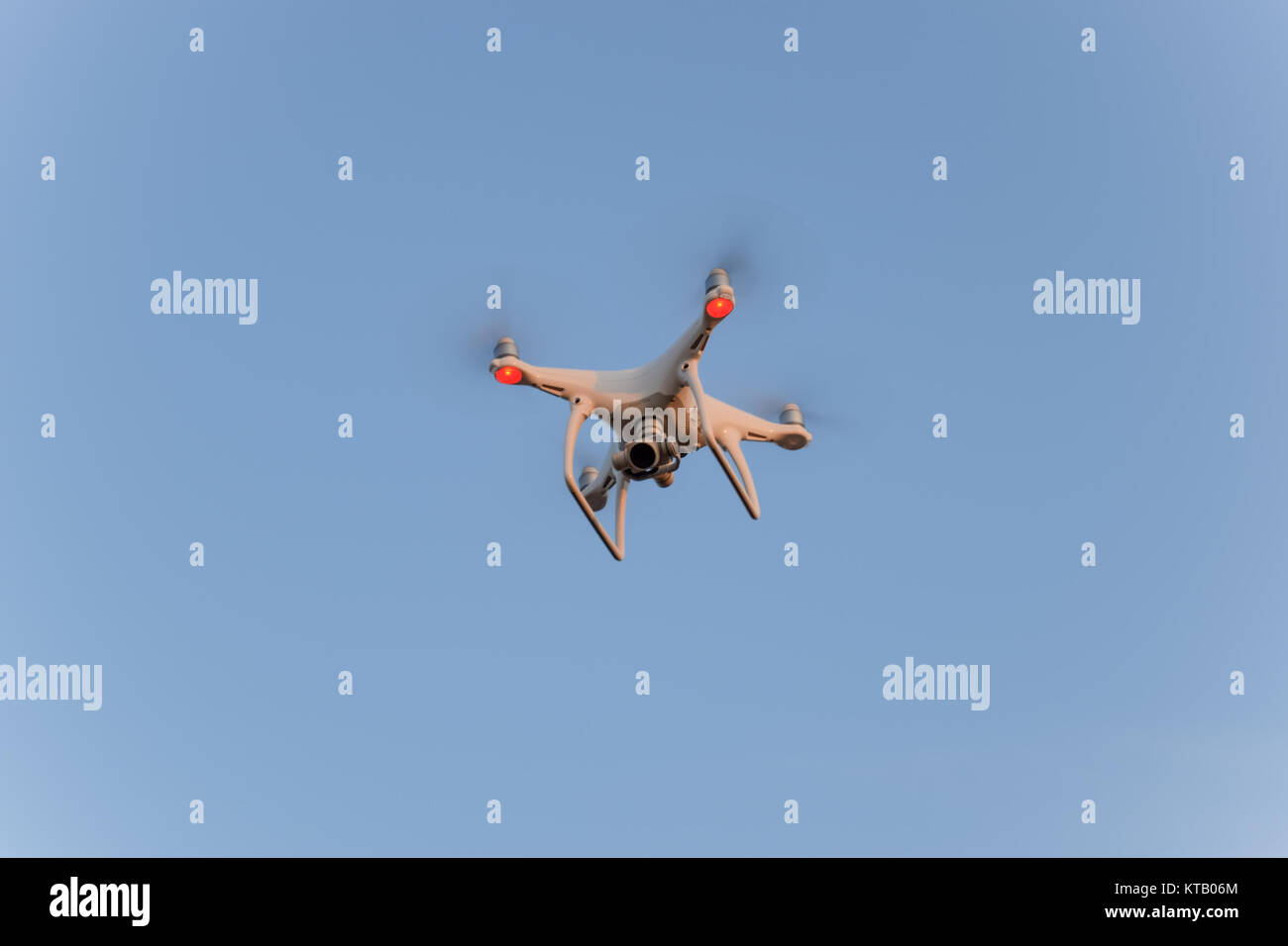 The drone, hovering in the sky. Flight quadrocopters Stock Photo Alamy