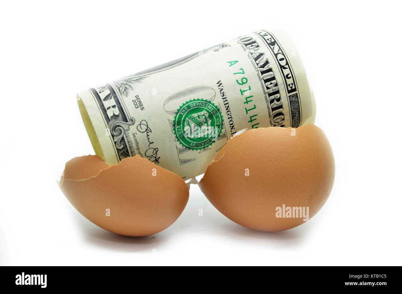 US dollar on cracked egg Stock Photo Alamy
