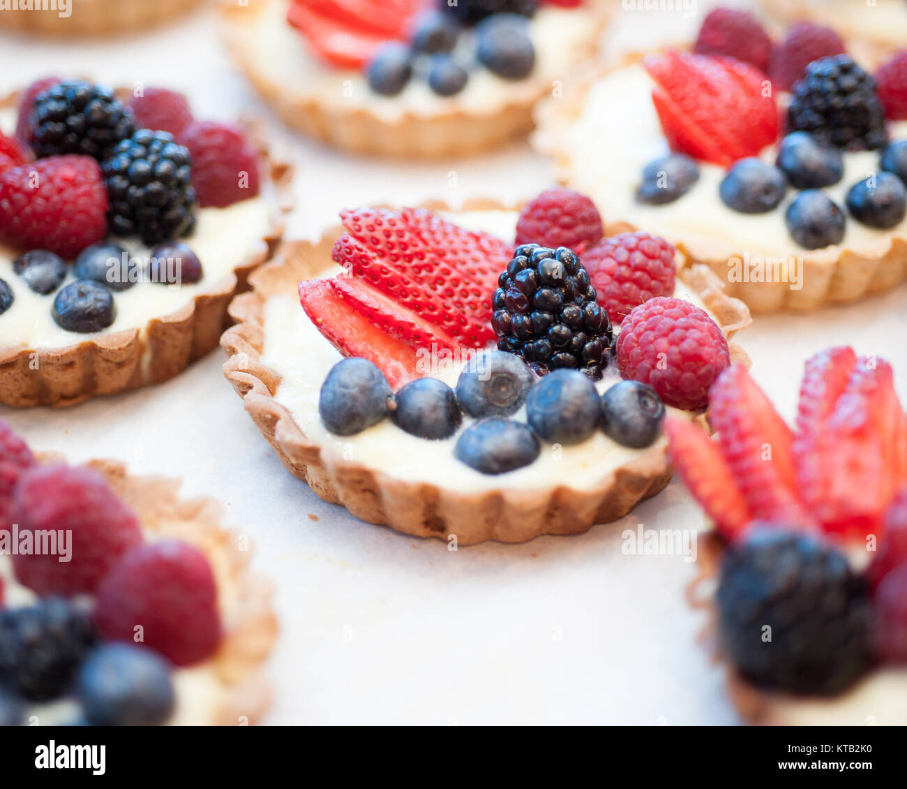 Raspberry blueberry and strawberry tarts Stock Photo Alamy