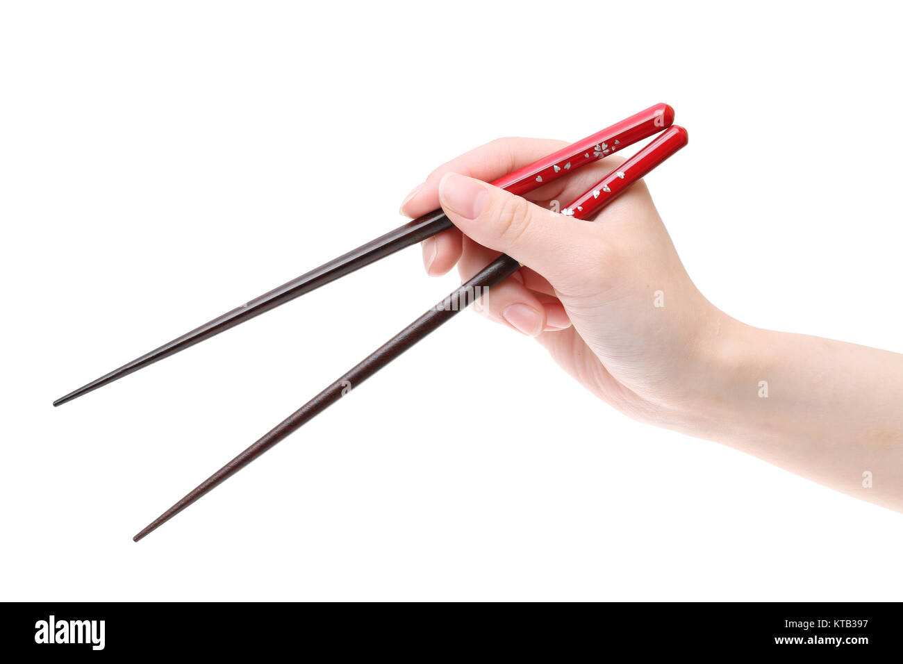 Hand holding wooden chopsticks isolated on white background Stock Photo