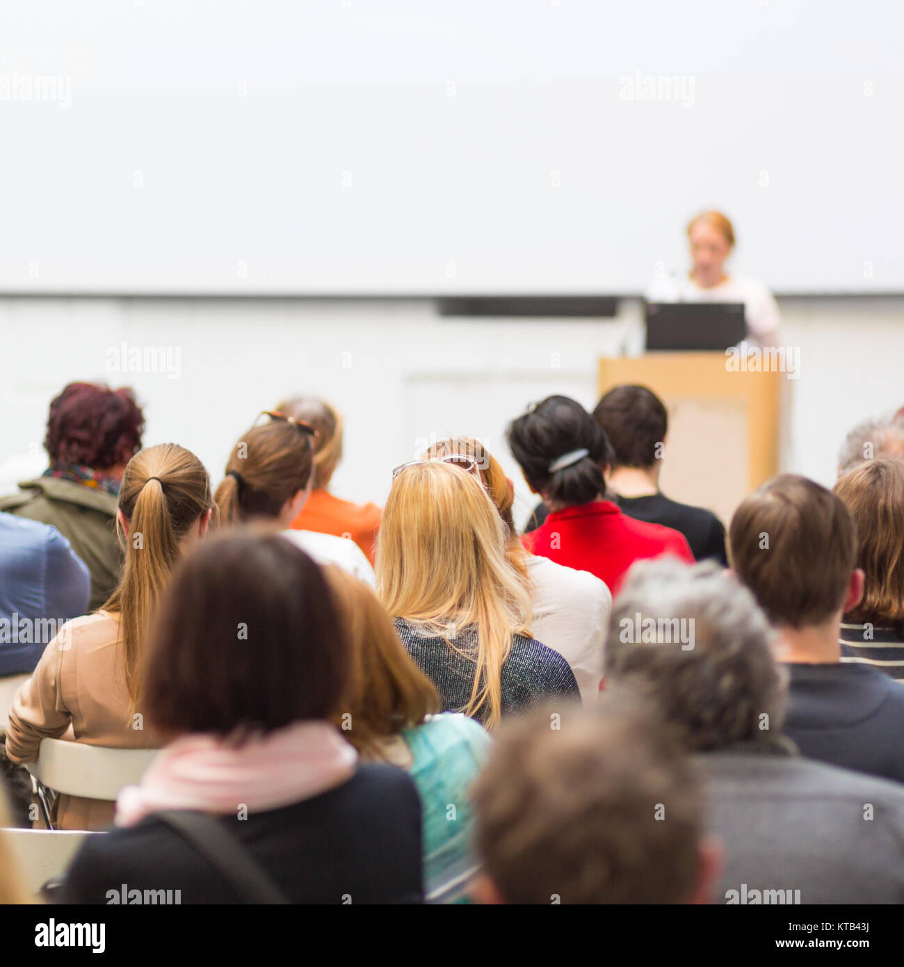 Woman giving presentation on business conference Stock Photo - Alamy