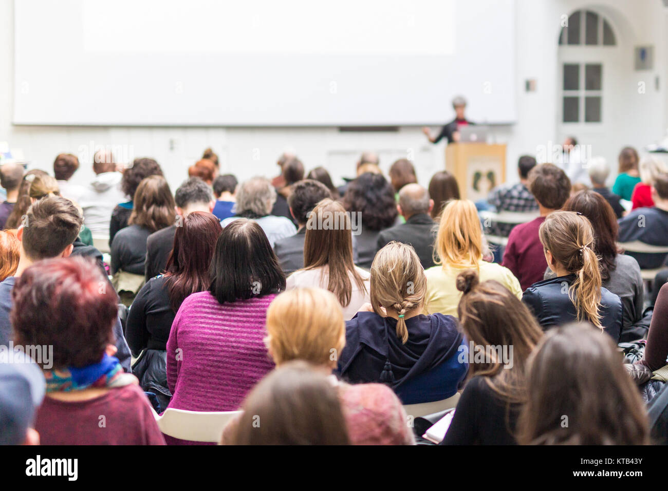 Woman giving presentation on business conference Stock Photo - Alamy