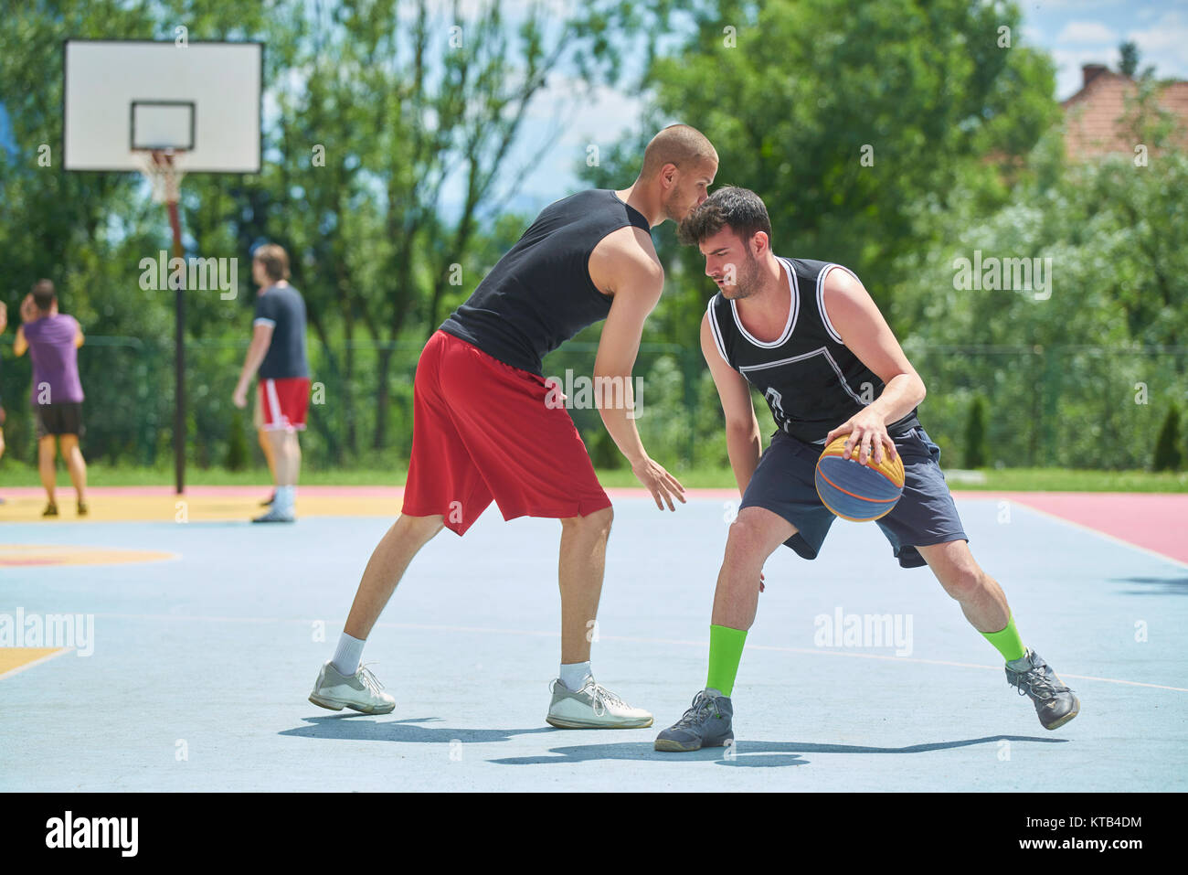 Young boys playing basketball Stock Photo - Alamy