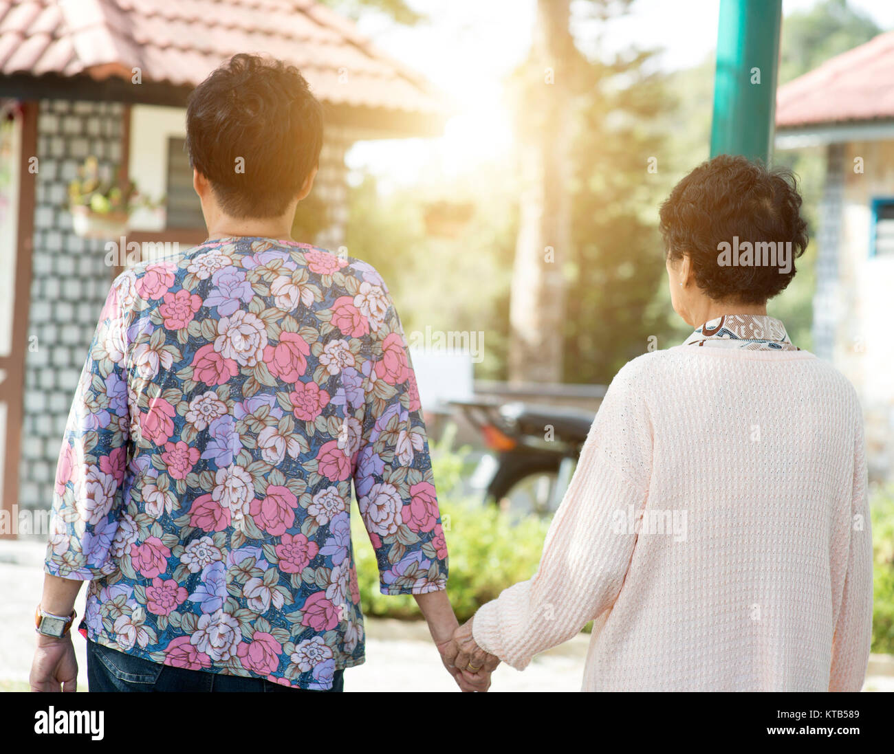 Rear view Asian elderly women walking at outdoor park Stock Photo - Alamy