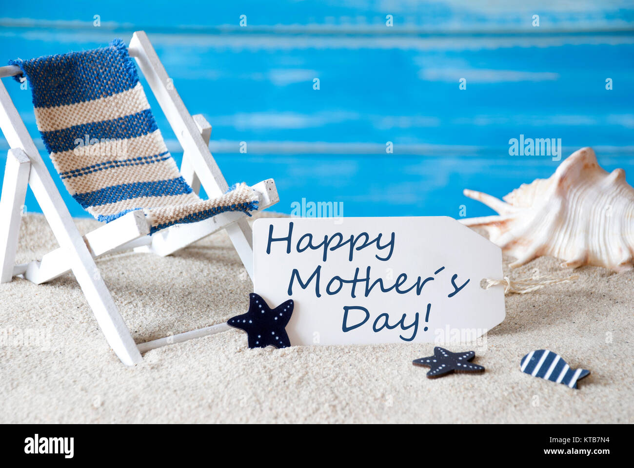 Summer Label With English Text Happy Mothers Day Blue Wooden Background Card With Holiday Greetings Beach Vacation Symbolized By Sand Deck Chair And Shell Stock Photo Alamy