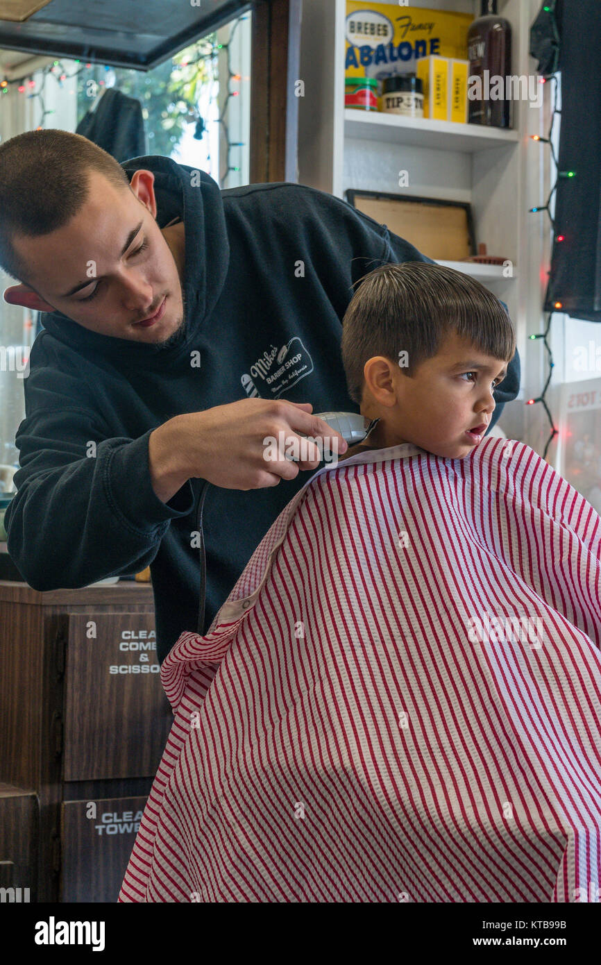 Young 2 Year Old Boy Getting His Haircut In A Barber Shop In Morro