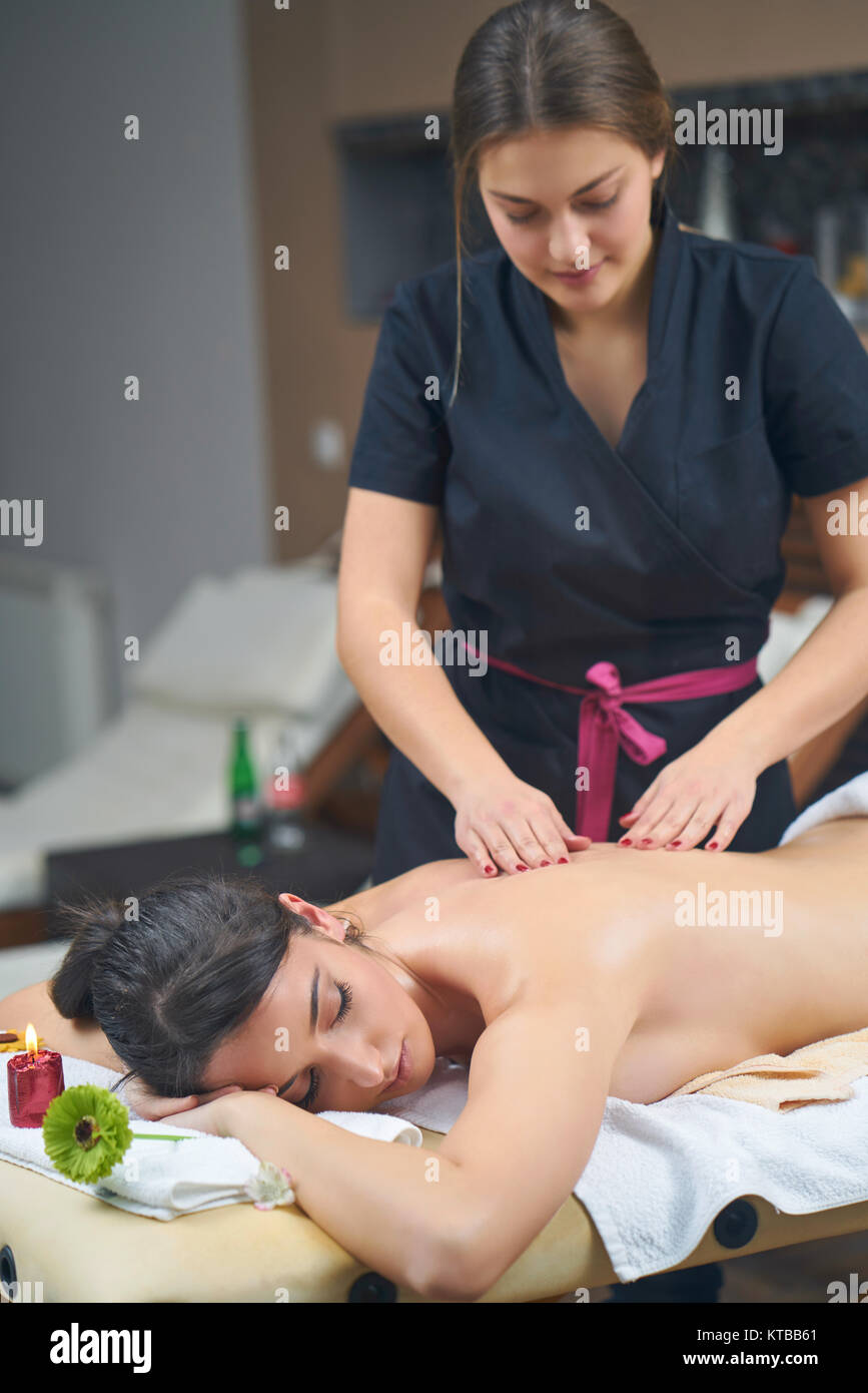 Spa woman. Female enjoying relaxing back massage in cosmetology spa centre.  Body care, skin care, wellness, wellbeing, beauty treatment concept Stock  Photo - Alamy