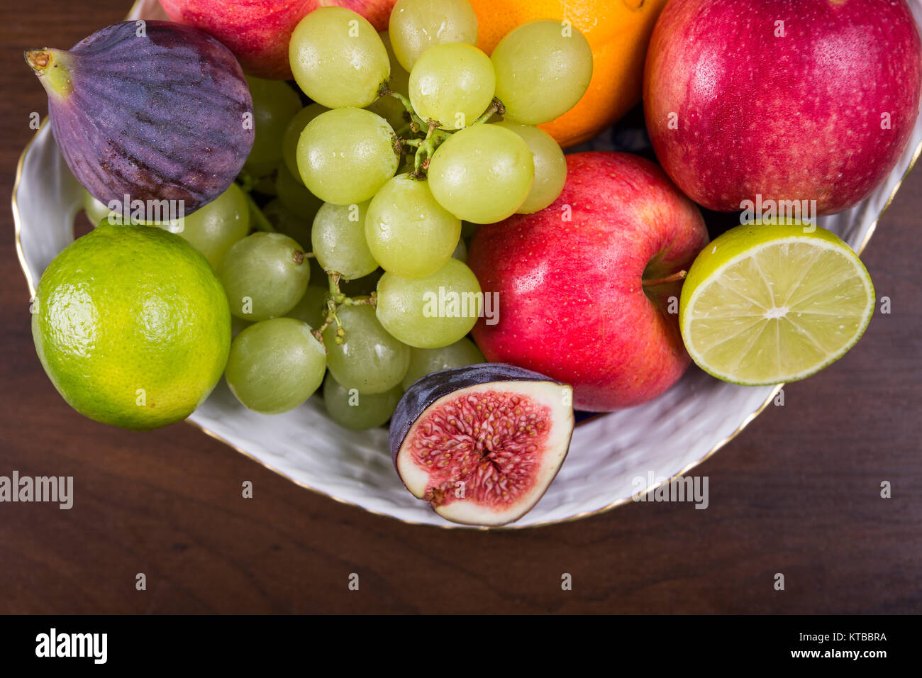 Assortment fruits on wooden table Stock Photo - Alamy