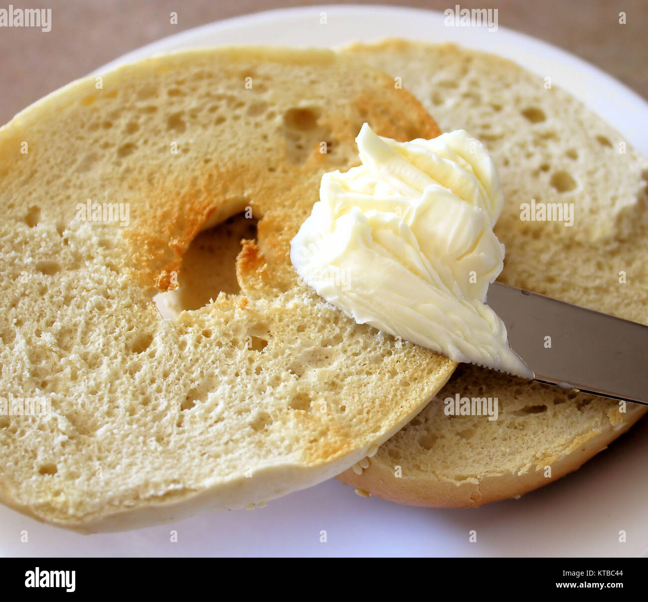 Toasted Bagel With Whipped Butter Stock Photo