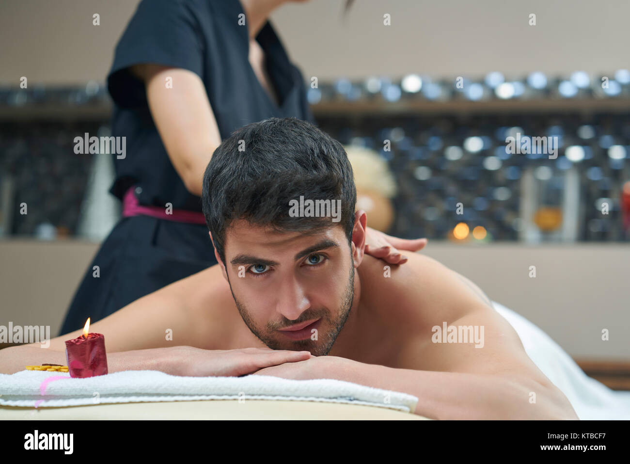 Sports massage. Massage therapist massaging shoulders of a male athlete