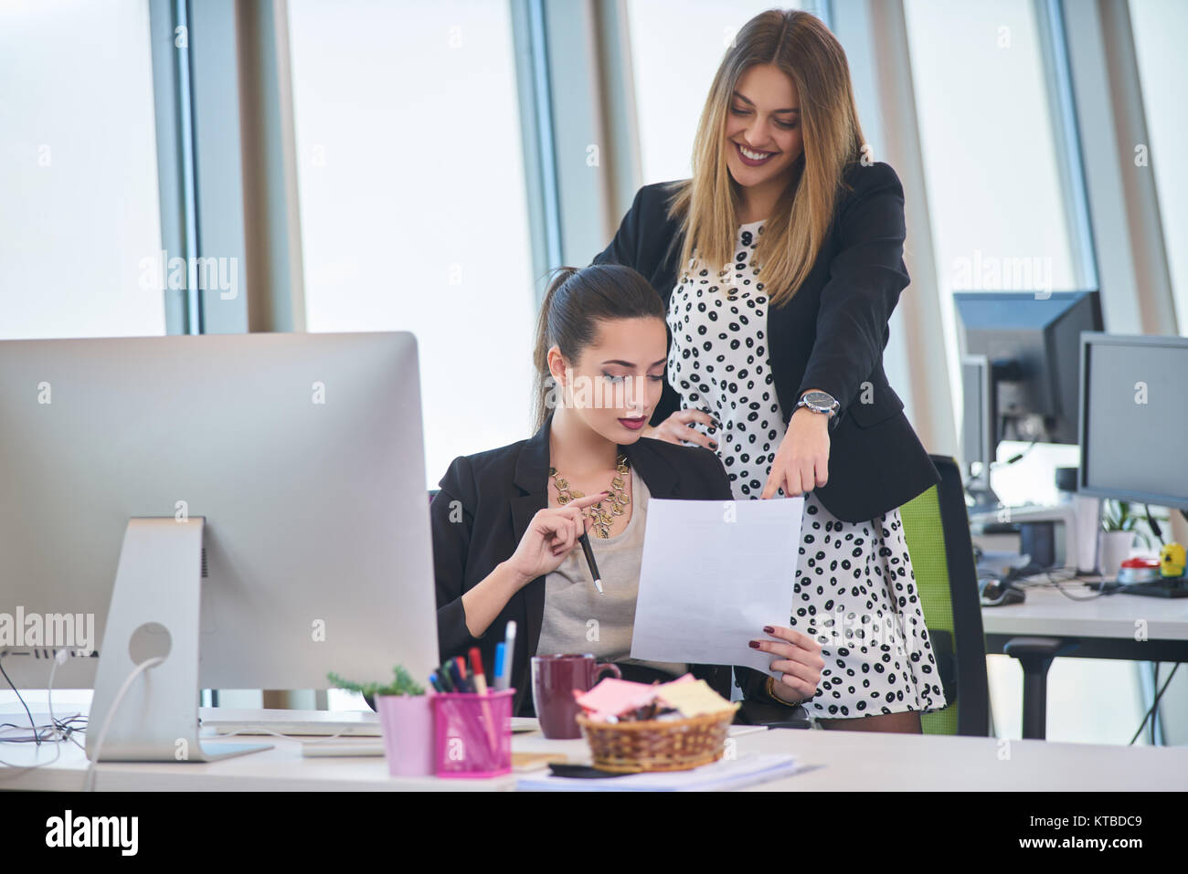 Businesswomen Having Informal Meeting In Modern Office Stock Photo - Alamy