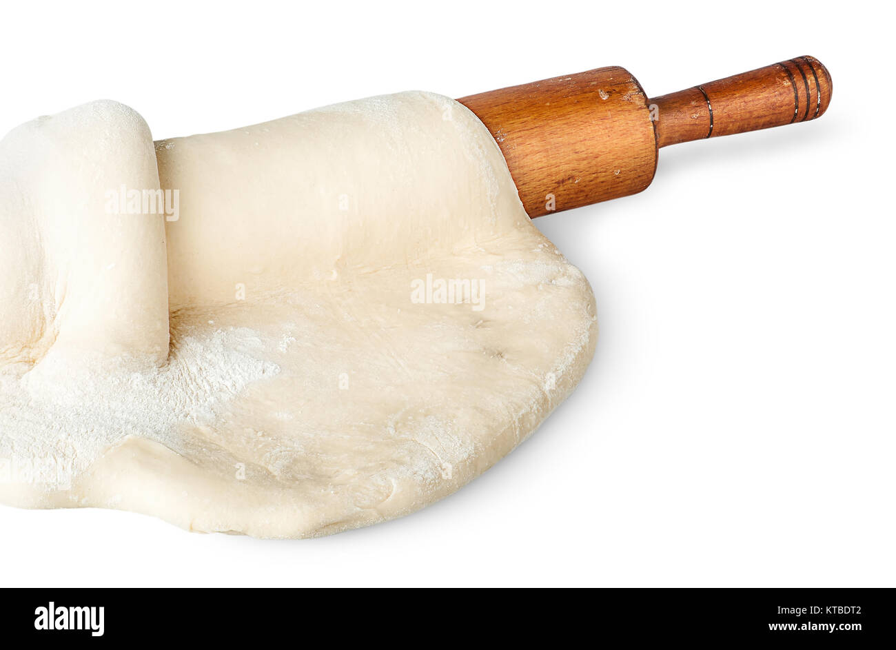 Closeup rolling pin covered with dough Stock Photo