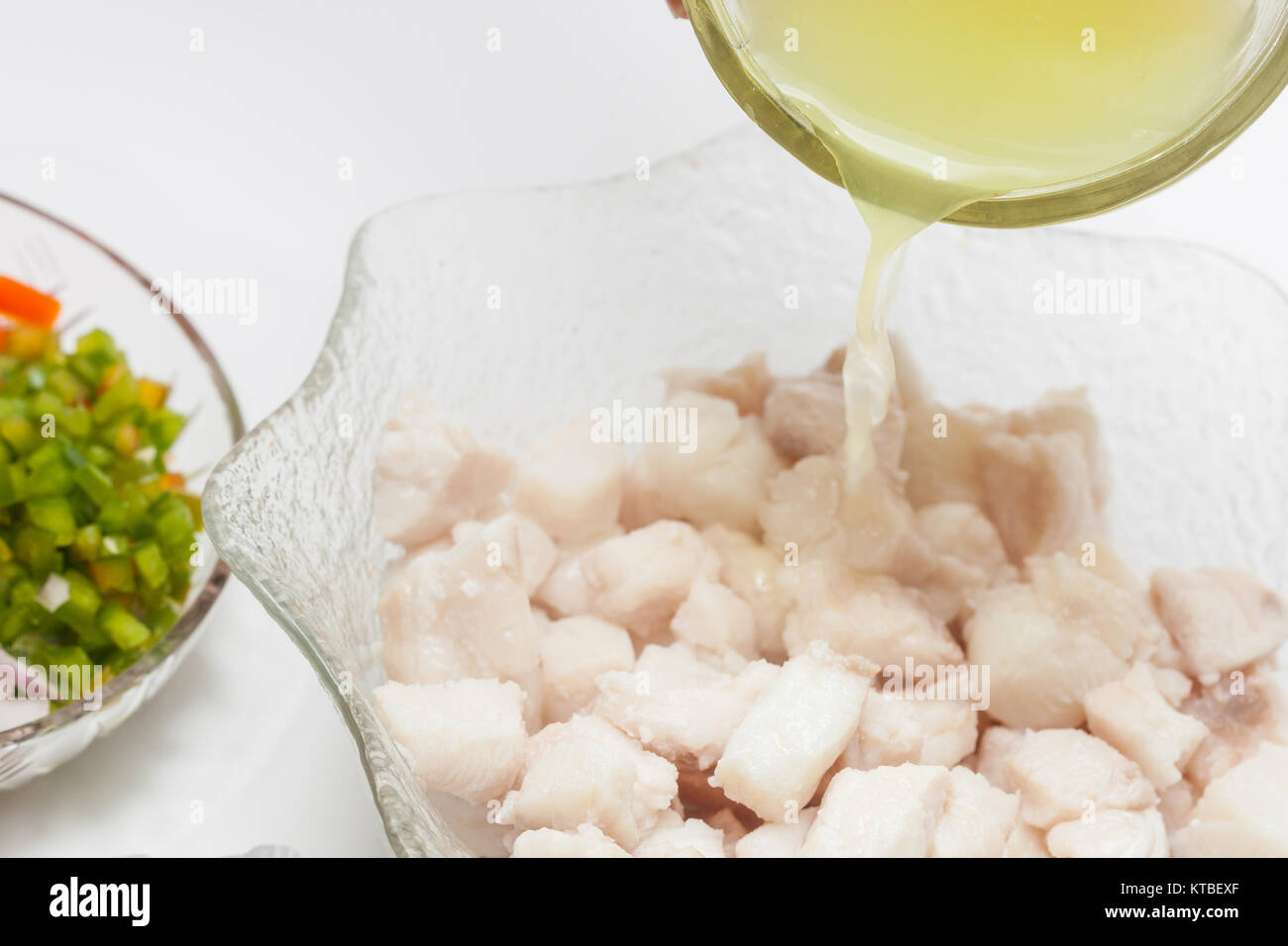 Marinate fish in lemon juice Stock Photo Alamy