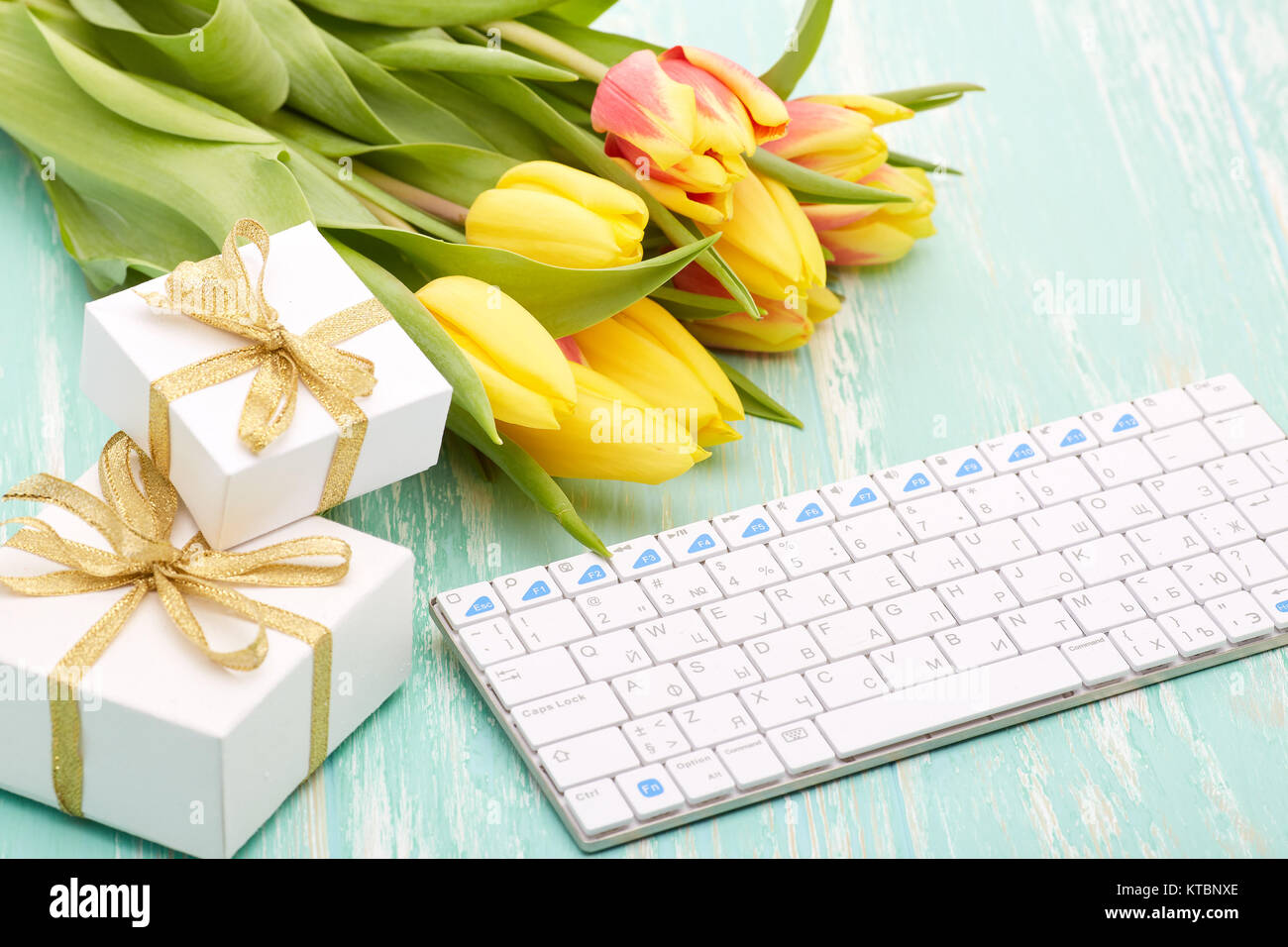 Keyboard, gifts and flowers Stock Photo Alamy