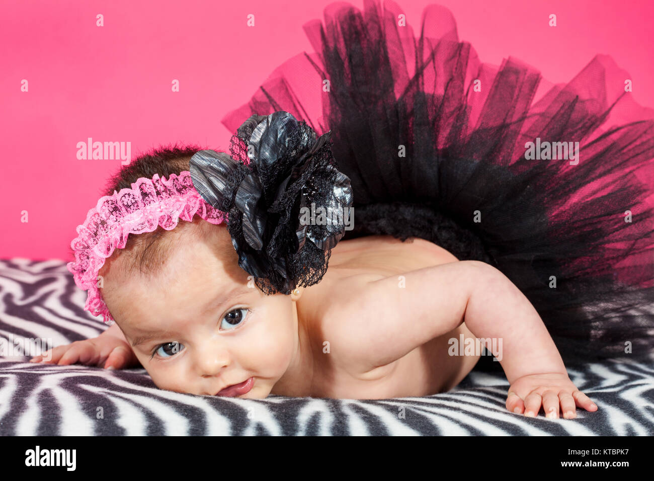 Four months old baby girl wearing a black tutu Stock Photo