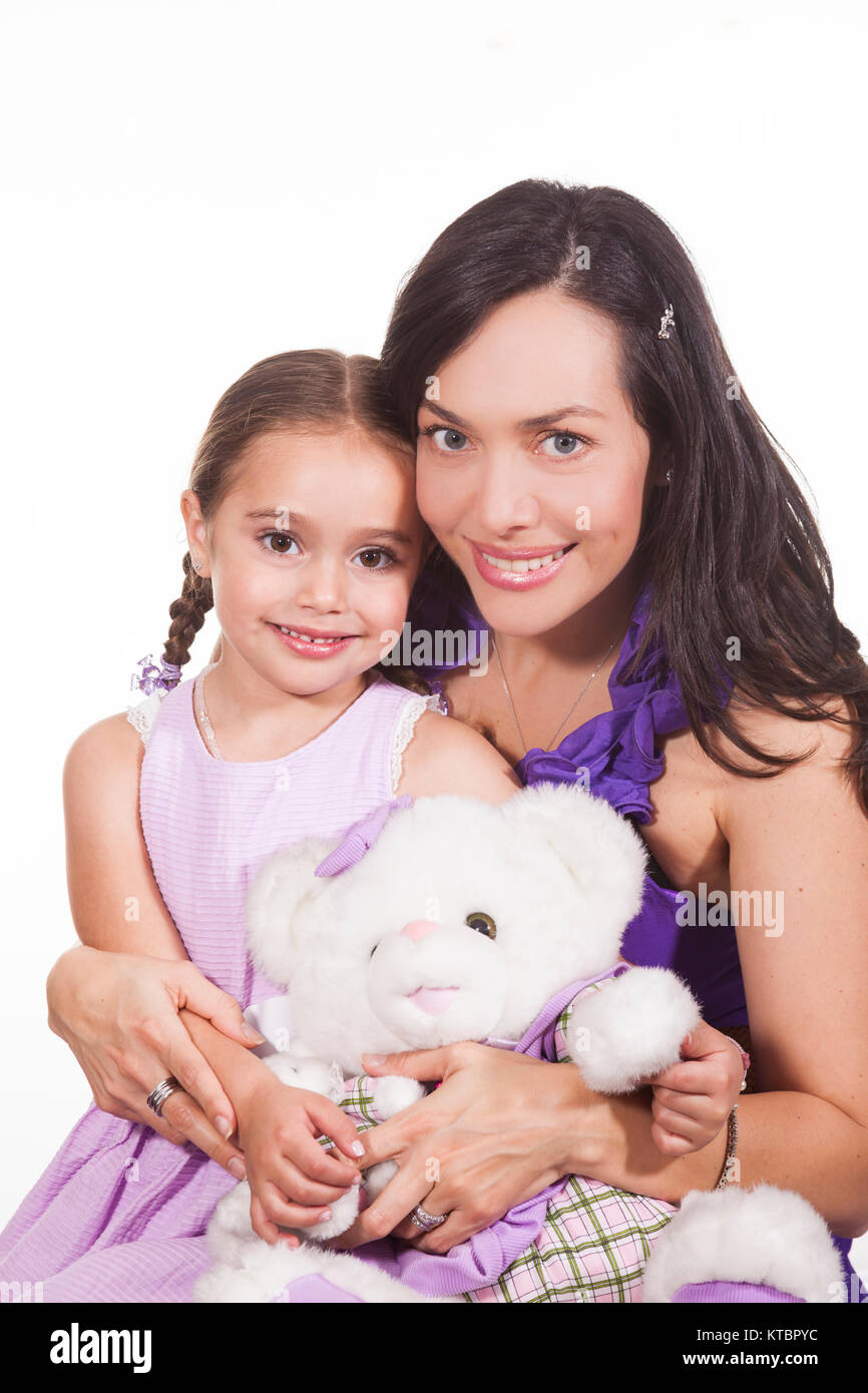 Mother with her young girl and a teddy bear Stock Photo - Alamy