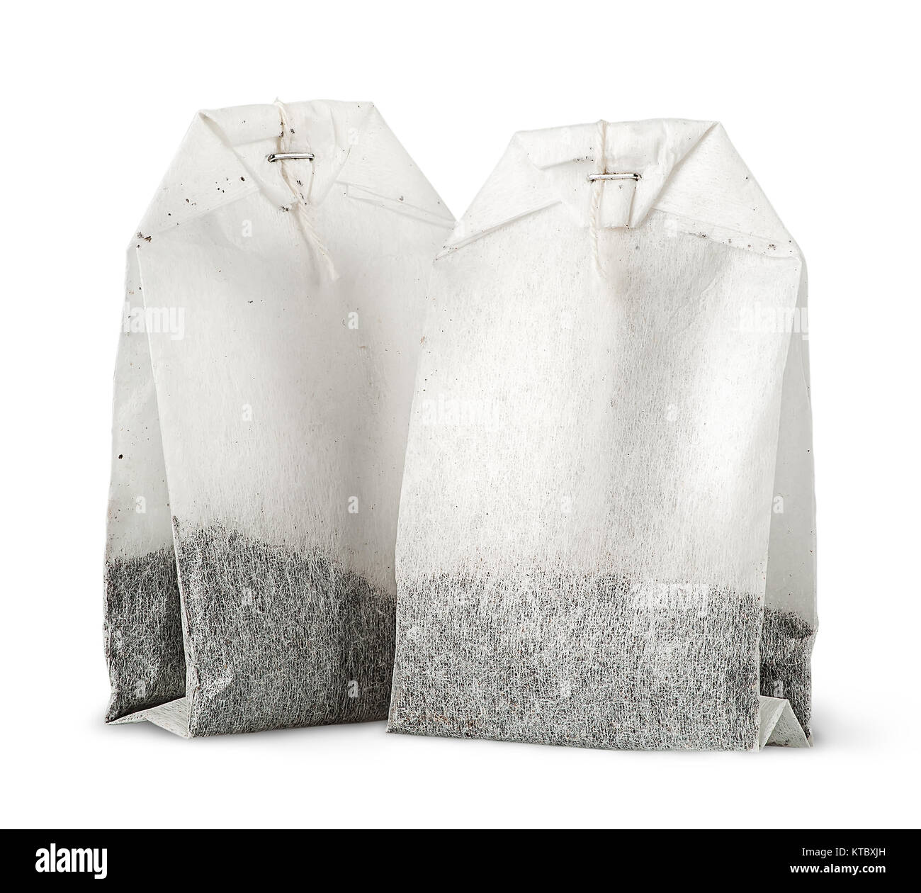Two tea bags with thread vertically Stock Photo