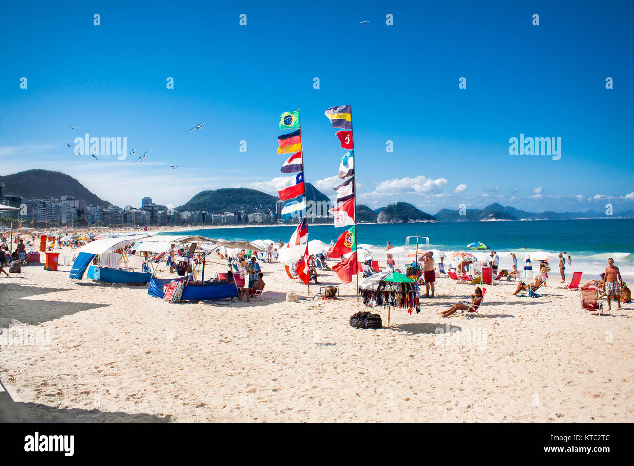 RIO DE JANEIRO, BRAZIL - APRIL 24, 2015: Flags and Brazilians on April 24, 2015 at Copacabana Beach, Rio de Janeiro. Brazil. Stock Photo