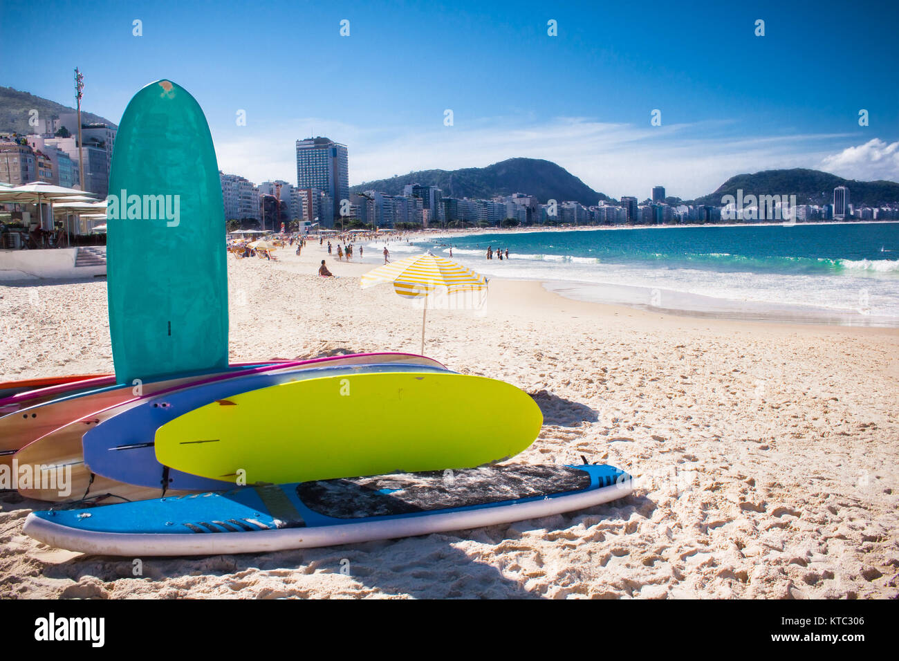 RIO DE JANEIRO, BRAZIL - APRIL 24, 2015: Surfboard and Brazilians on April 24, 2015 at Copacabana Beach, Rio de Janeiro. Brazil. Stock Photo