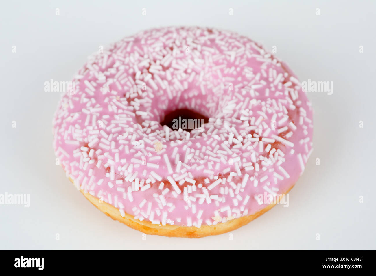 pink doughnut with sprinkles Stock Photo Alamy