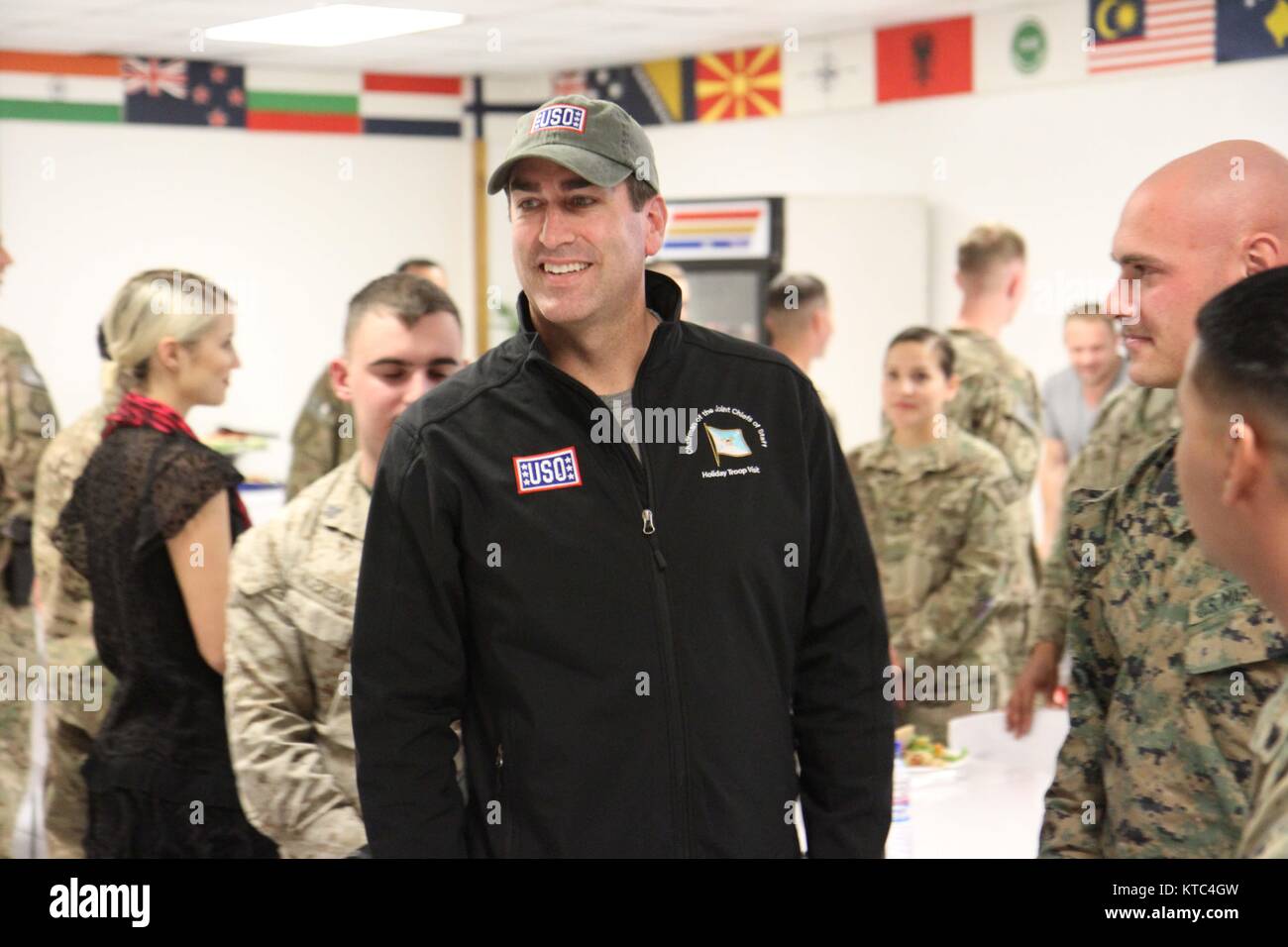 Comedian Rob Riggle chats with military service members during the USO  Holiday troop visit at Bagram Air Field December 9, 2014 in Bagram,  Afghanistan Stock Photo - Alamy