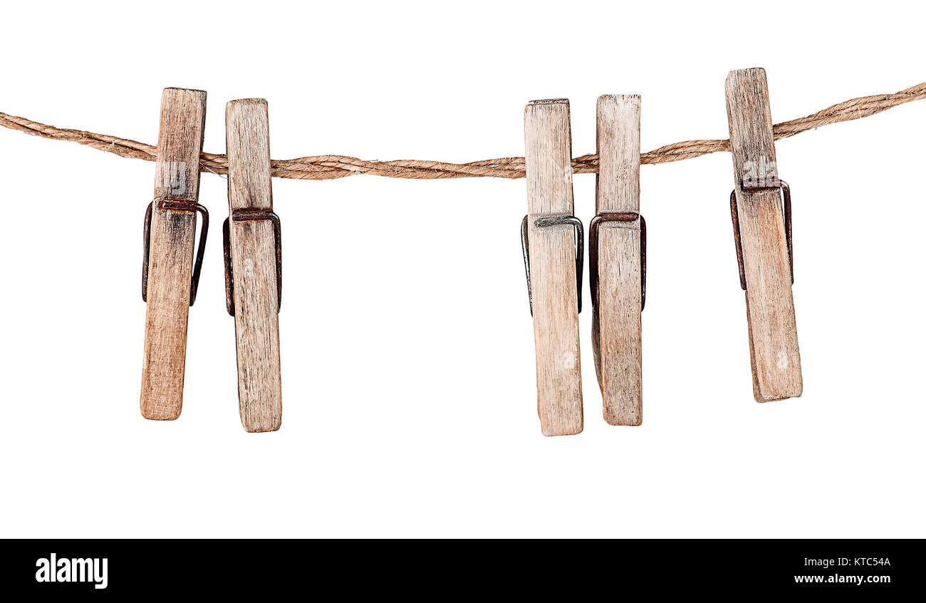 Five old clothespins on rope Stock Photo Alamy