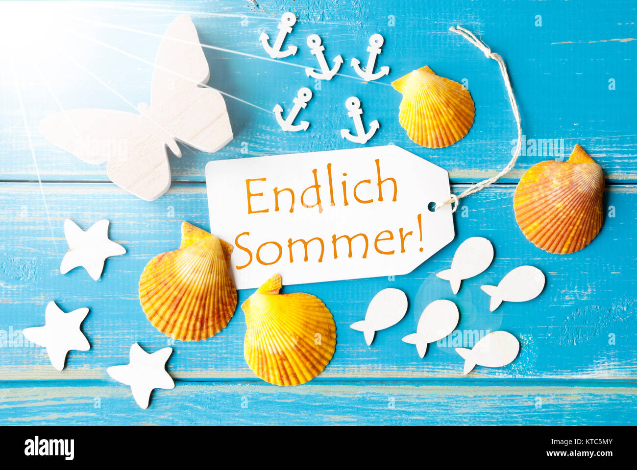 Flat Lay View Of Label With German Text Endlich Sommer Means Happy