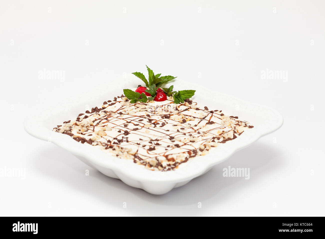 Decorated Napoleon dessert in a white bowl Stock Photo